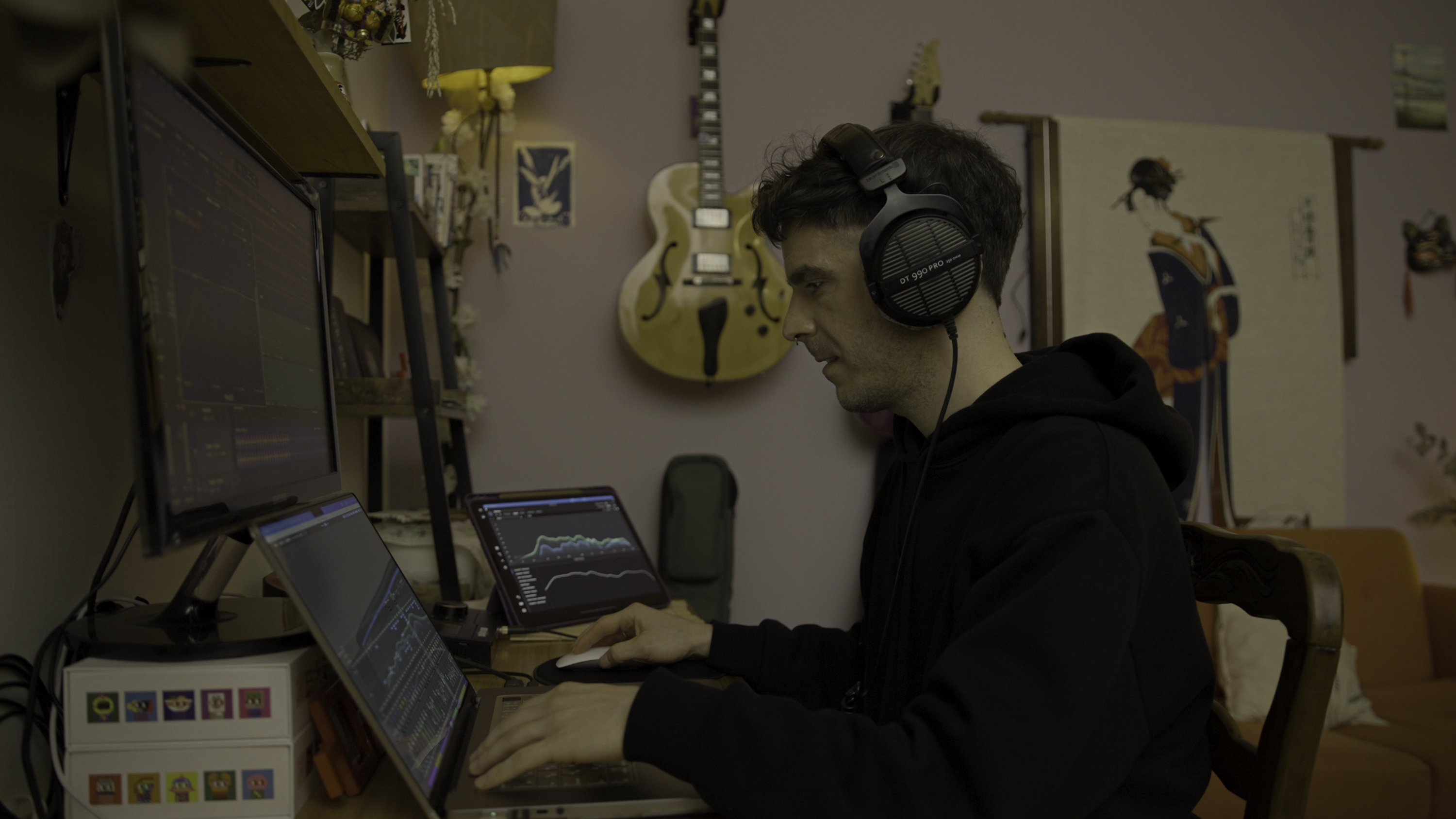 Santiago working with professional audio equipment and headphones